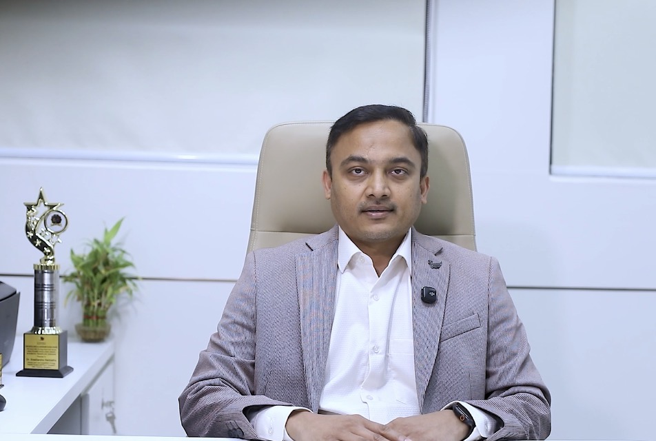 Dr. Sreeharsha Harinatha seated in a consultation room