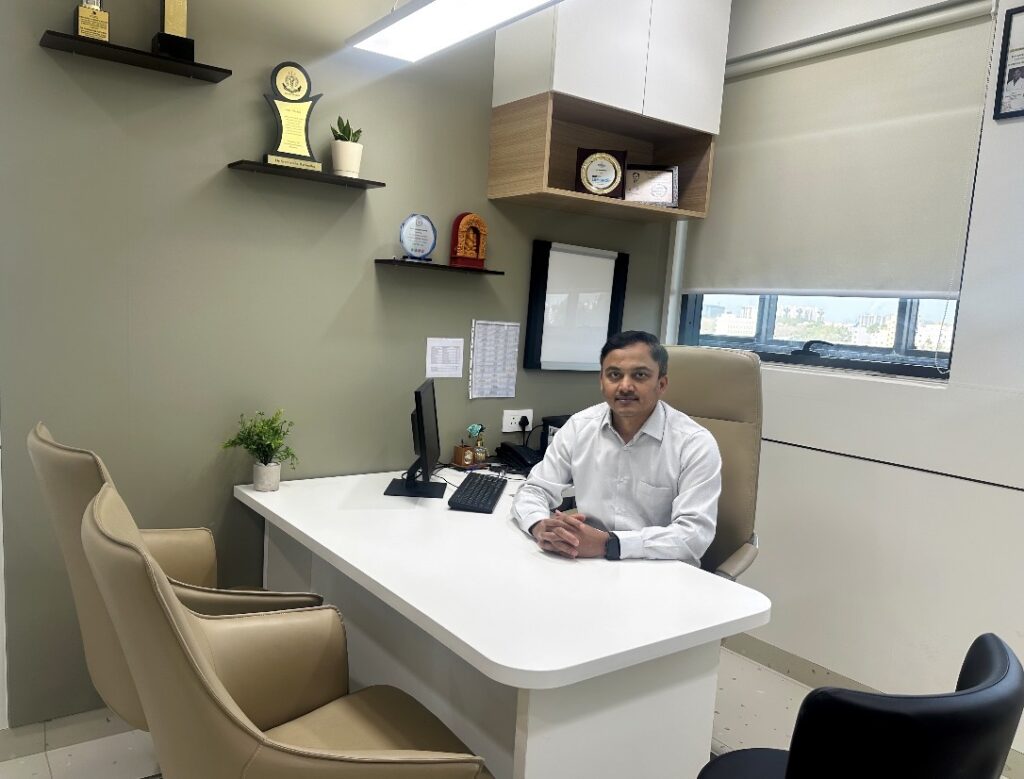 Dr. Sreeharsha Harinatha in a consultation room