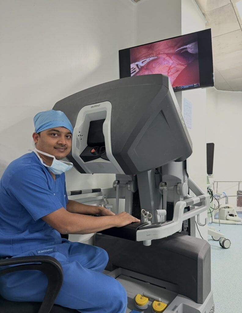 Dr. Sreeharsha Harinatha at a robotic surgical console