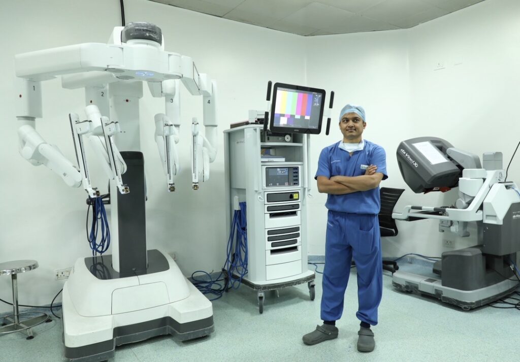 Dr. Sreeharsha Harinatha with a robotic surgical system